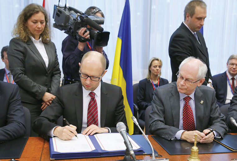 Prime Minister Arseniy Yatsenyuk of Ukraine and European Council President Herman von Rompuy at the signing of the Association Agreement between Ukraine and the European Union on March 21 in Brussels.