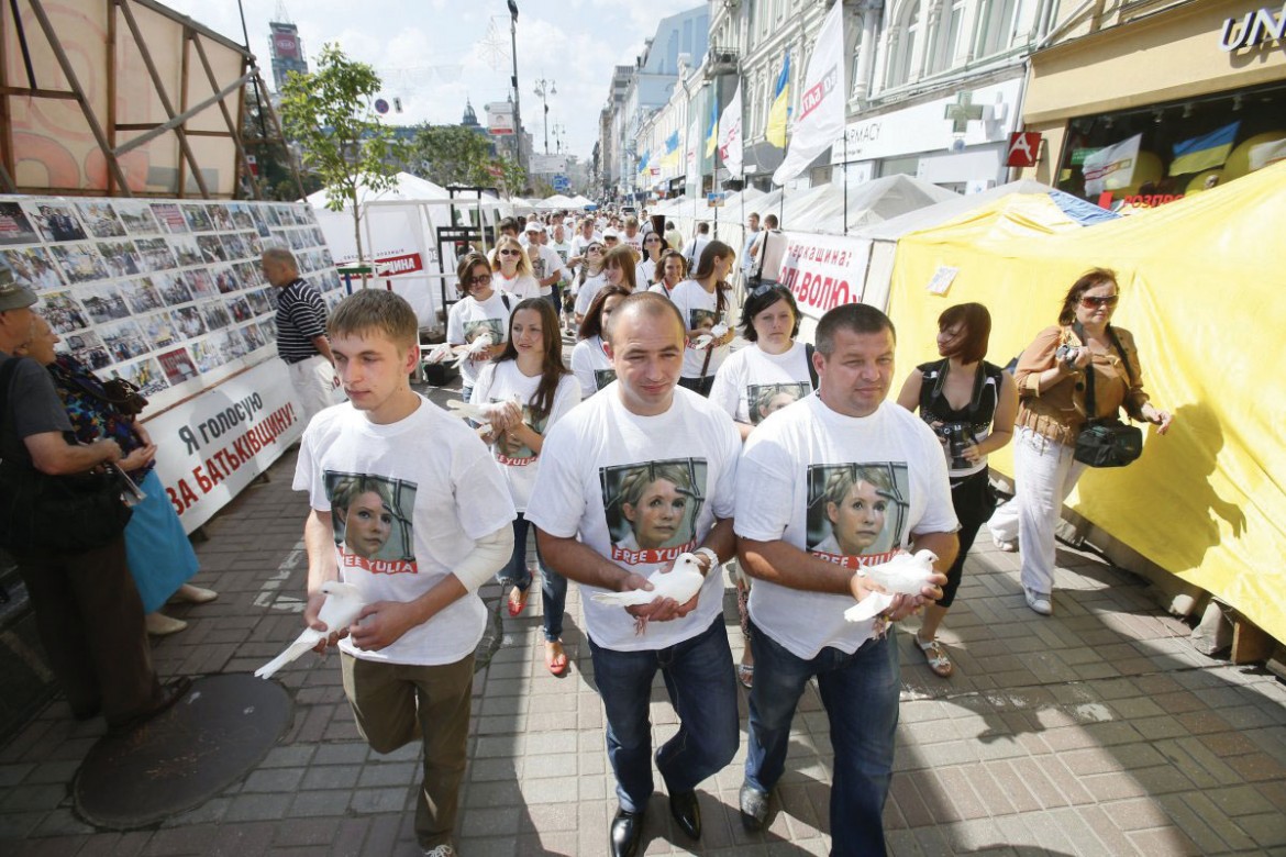 Demonstrators demand freedom for Yulia Tymoshenko during a protest held near the Pechersk Raion Court in Kyiv on August 5, marking the second anniversary of her imprisonment.