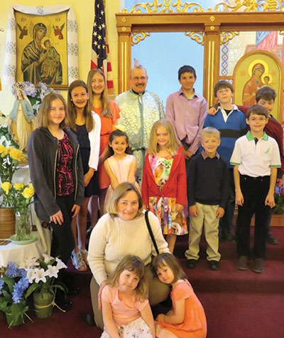 HILLSIDE, NJ - On Sunday, May 3, the children of Immaculate Conception Ukrainian Catholic parish brought fl owers to the Blessed Mother and crowned her as everyone sang hymns. This also marked the end of this season’s religious education classes. The classes are an innovative multimedia program designed for children age 3-18, grouped by age and taught by seven teachers. Special emphasis is placed on learning about the Ukrainian Catholic eastern rite, as well as discussing similarities to and differences from the Latin rite. (The parish is accepting religious ed registrations for 2015-2016 until June 28.) – Joe Shatynski
