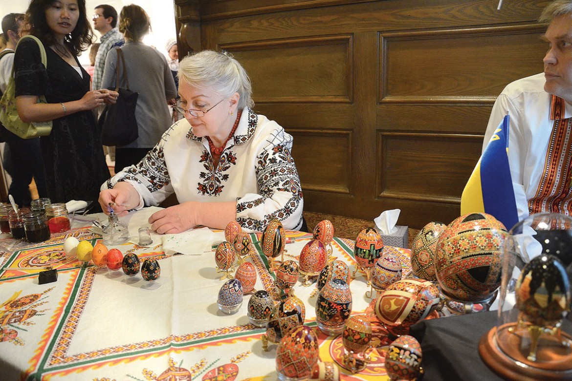 Halyna Mudra demonstrates how to make Ukrainian Easter eggs at the United Help Ukraine exhibit in the Lithuanian Embassy’s open house event in Washington.