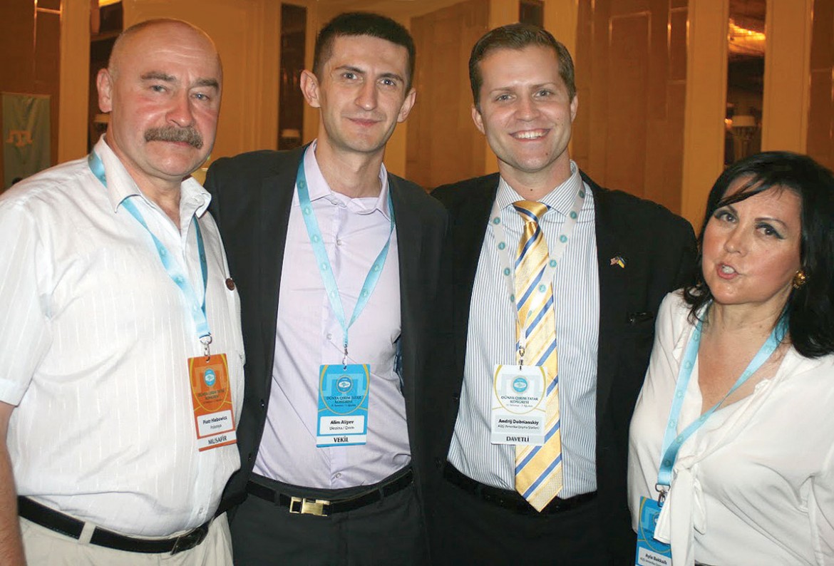 Meeting during the congress (from left) are: Piotr Hlebowicz, Alim Aliyev, Andrij Dobriansky and Ayla Bakkalli, U.S. representative of the Crimean Tatar Mejlis.