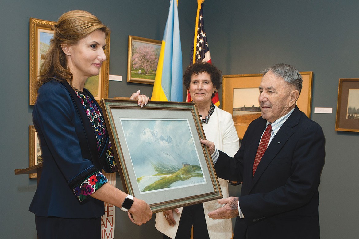 Ukraine’s First Lady Maryna Poroshenko accepts a gift from Zenowij Onyshkewych of one of his paintings during the opening of his solo exhibition at The Ukrainian Museum. Pictured in the center is Renata Holod, president of the museum’s board of trustees.