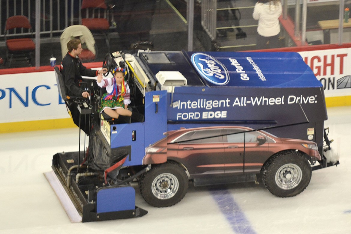 Andrea Hyra from the Whippany, N.J., branch of the Ukrainian American Youth Association, rides on the Zamboni.
