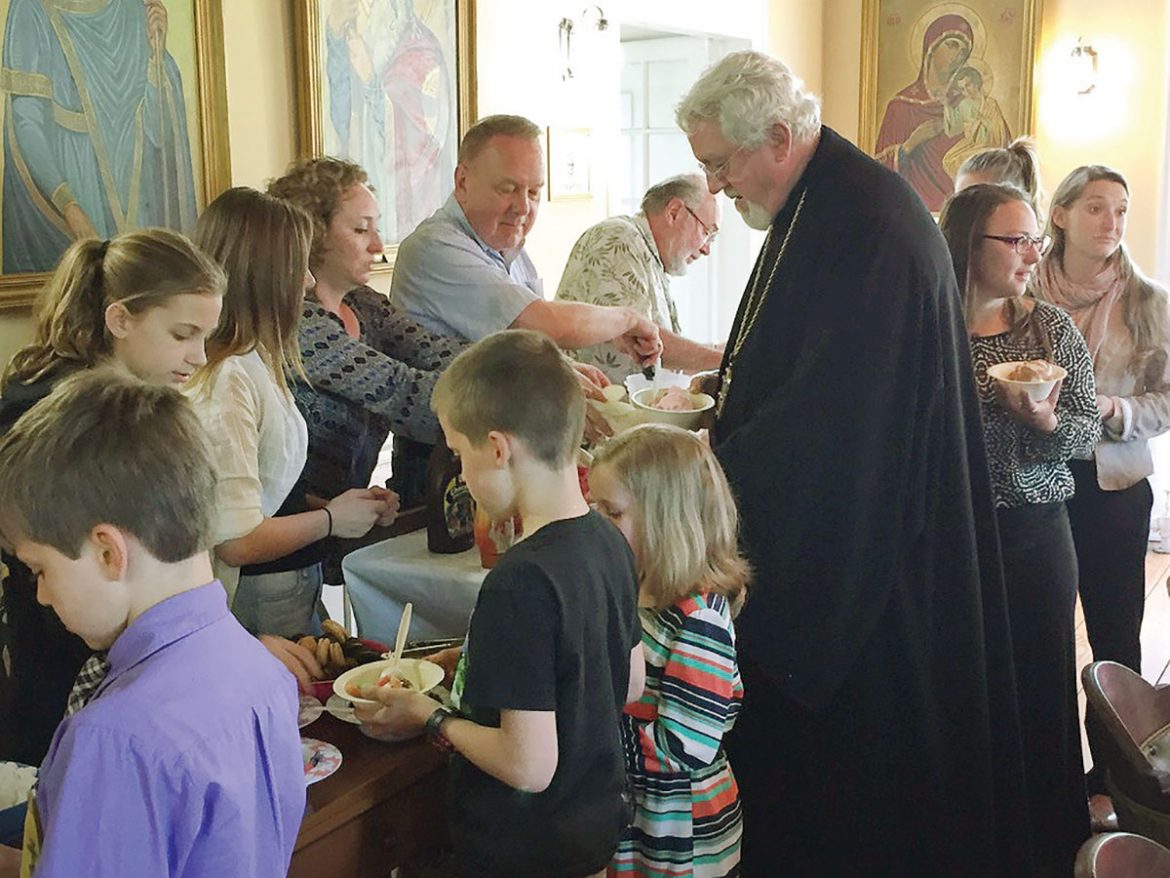 Metropolitan Antony joins children and pilgrims during the ice cream social held at the St. Sophia Theological Seminary.