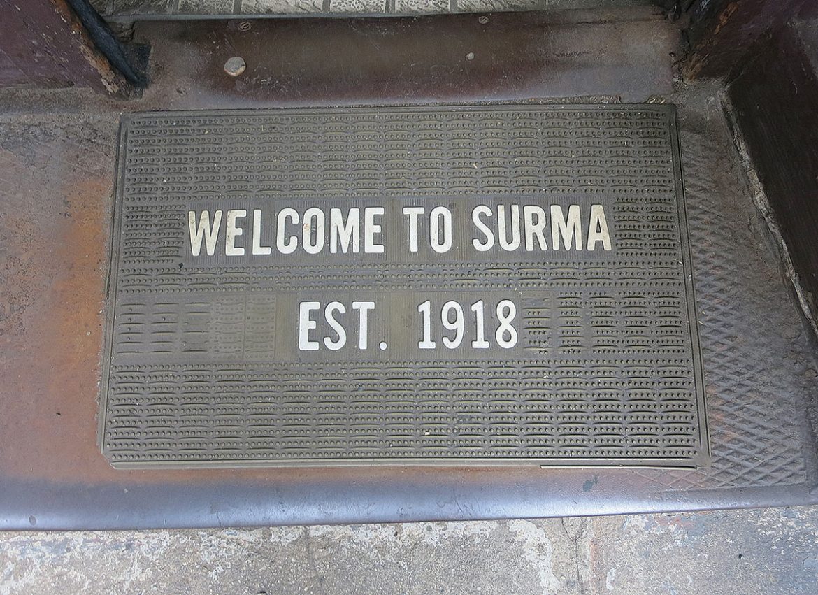 The welcome mat outside of the Surma shop.