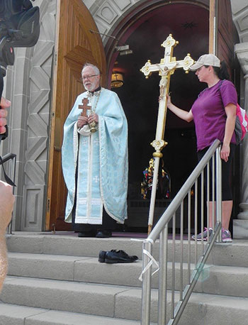 Msgr. Myron Grabowsky greets the McAdoo parishioners upon their arrival at St. Michael’s Ukrainian Greek-Catholic Church in Shenandoah, Pa. 