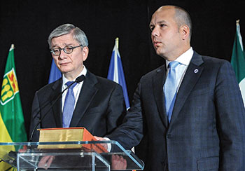 Ukrainian World Congress President Eugene Czolij (left) swears in newly re-elected UCC National President Paul Grod.