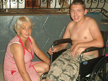 Bohdan Tokar and his mother, Halya, of the Bohdan Society for invalid children in the area of Chernivtsi. 