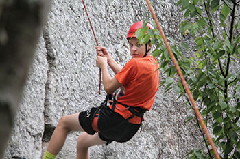 Pavlo Pencak learns rock climbing. 
