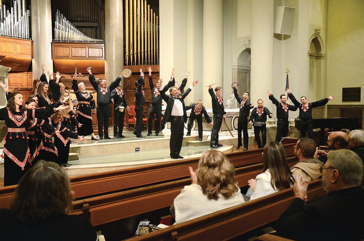 Kyiv Chamber Choir conductor Mykola Hobdych joins his choristers in responding to the audience’s ovation at the conclusion of their Ukrainian sacred and folk music concert at the National City Christian Church in Washington on November 6. The concert was part of the choir’s “Sounds of Ukraine” tour of the U.S.