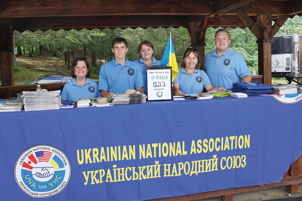 Employees and volunteers man the Ukrainian National Association gazebo.
