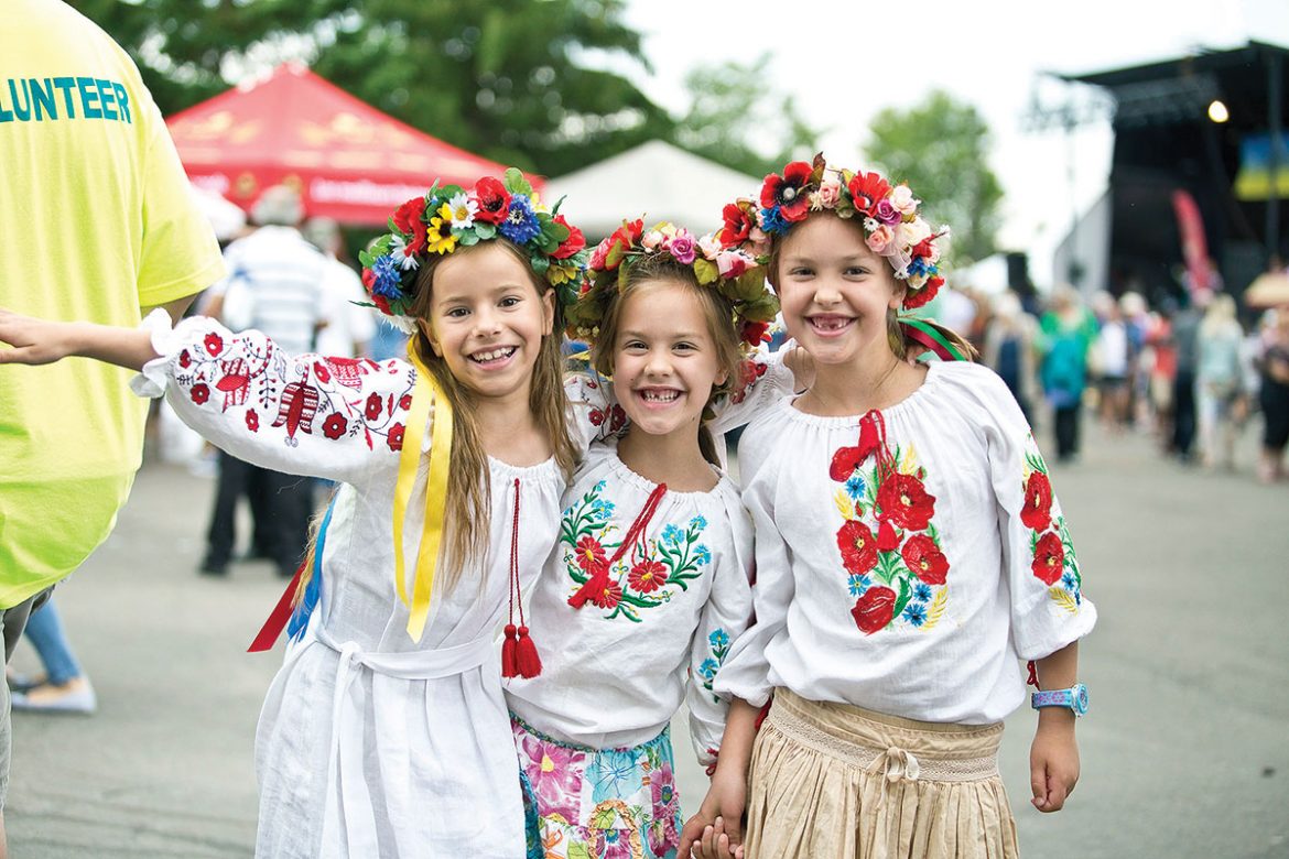 Three young girls enjoy the festival.