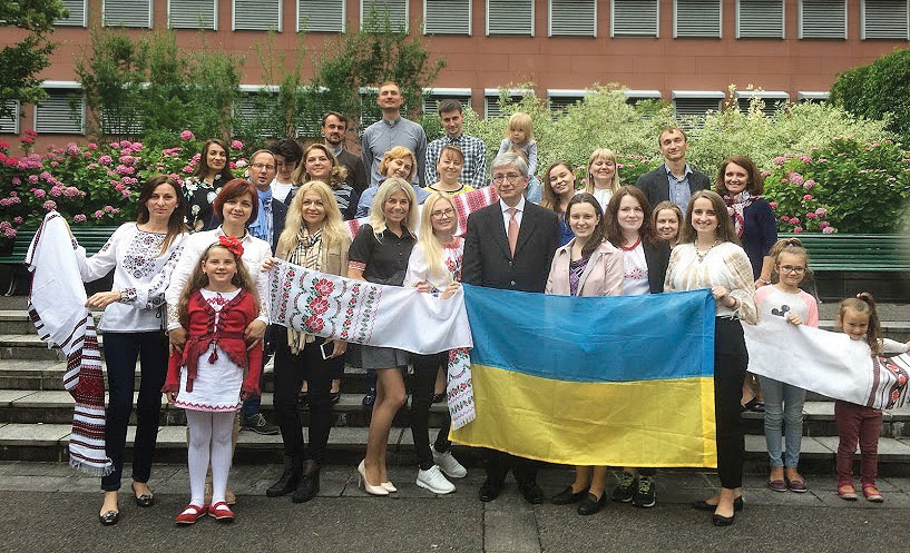 Ukrainian World Congress President Eugene Czolij with Ukrainian community members in Zurich.