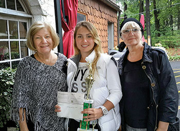 Women’s champion Maryna Zhytska flanked by Petrusia Sawchak (left) and UNA Treasurer Roma Lisovich.
