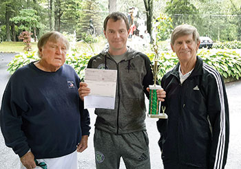 Men’s co-champion Oleksandr Zavorotnyi with the USCAK’s Tennis Committee’s Yurko Sawchak (left) and Ivan Durbak.