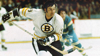 Johnny Bucyk chases the puck down the ice during the later years of his career.