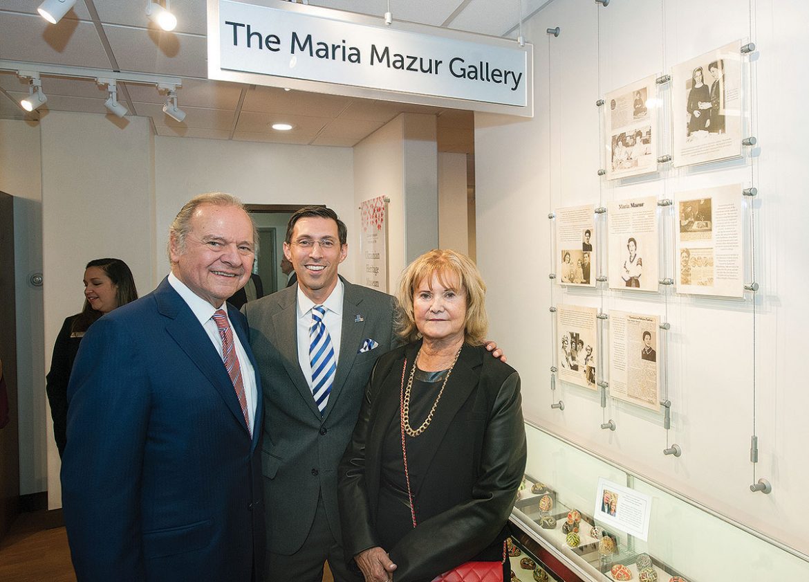 Leonard and Helena Mazur with Jonathan Peri, president of Manor College, in front of the new Maria Mazur Gallery, named in honor of Mr. Mazur’s mother. 