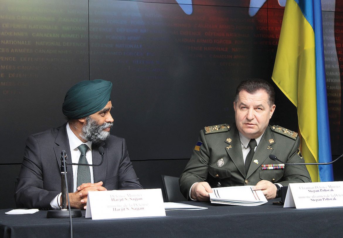 Canadian Defense Minister Harjit Sajjan and Ukrainian Defense Minister Stepan Poltorak sign the Canada-Ukraine Defense Cooperation Agreement on April 3.