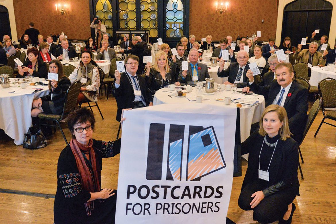 Participants of the conference in Toronto with postcards for Ukrainian political prisoners.
